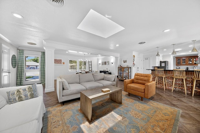 1602 Cimmaron Dr, Midland, TX 79705 - living room with ornamental molding, recessed lighting, and a skylight