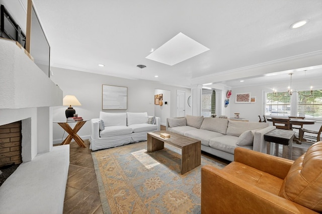 1602 Cimmaron Dr, Midland, TX 79705 - living room with ornate columns, recessed lighting, a chandelier, and a skylight