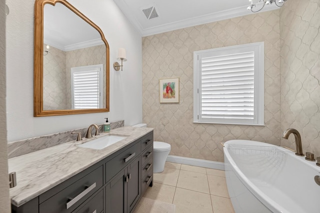 1602 Cimmaron Dr, Midland, TX 79705 - bathroom featuring crown molding, vanity, a freestanding bath, plenty of natural light, and wallpapered walls
