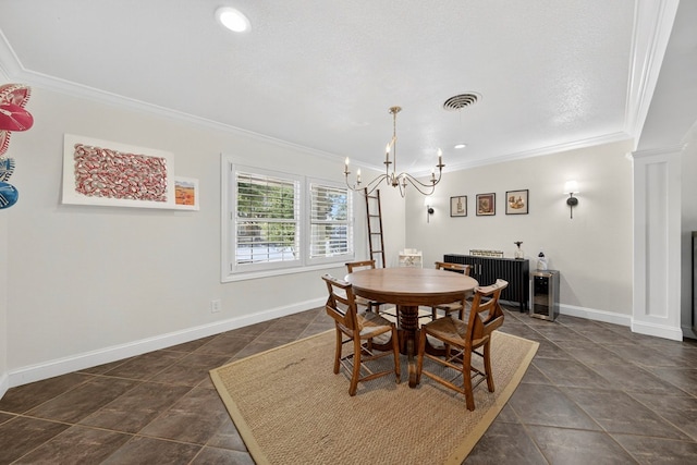 1602 Cimmaron Dr, Midland, TX 79705 - dining room with crown molding, a chandelier, decorative columns, and recessed lighting
