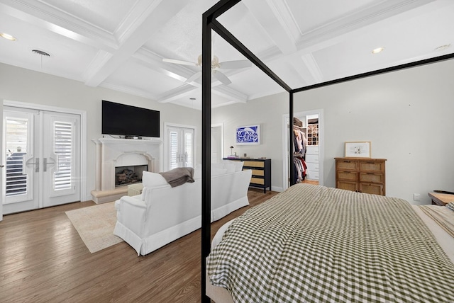 1602 Cimmaron Dr, Midland, TX 79705 - bedroom featuring coffered ceiling, wood finished floors, beamed ceiling, access to outside, and crown molding