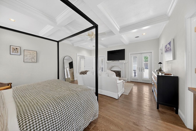 1602 Cimmaron Dr, Midland, TX 79705 - bedroom featuring coffered ceiling, wood finished floors, crown molding, beamed ceiling, and access to exterior