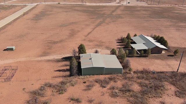 birds eye view of property with a rural view