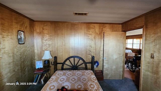 carpeted bedroom with crown molding