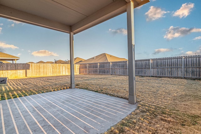 exterior space with a fenced backyard and a patio