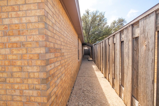 view of property exterior featuring brick siding