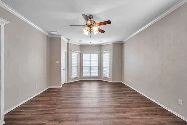 empty room featuring dark wood-style floors, baseboards, a ceiling fan, and crown molding