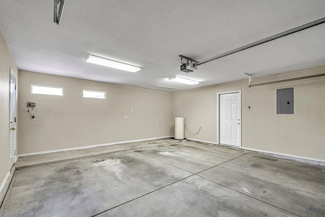 garage with electric panel, baseboards, and a garage door opener