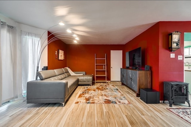 600 Liddon Unit 78, Midland, TX 79705 - living area with wood finished floors and a wood stove