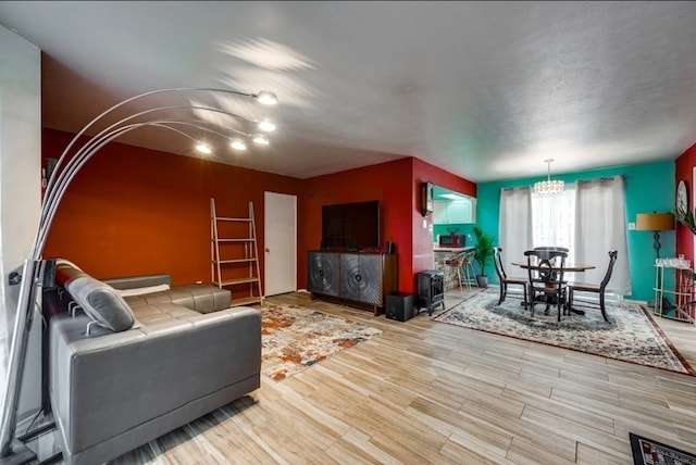 600 Liddon Unit 78, Midland, TX 79705 - living area featuring a chandelier and wood finished floors