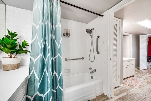 600 Liddon Unit 78, Midland, TX 79705 - full bath with shower / bath combo, a closet, vanity, and wood finished floors