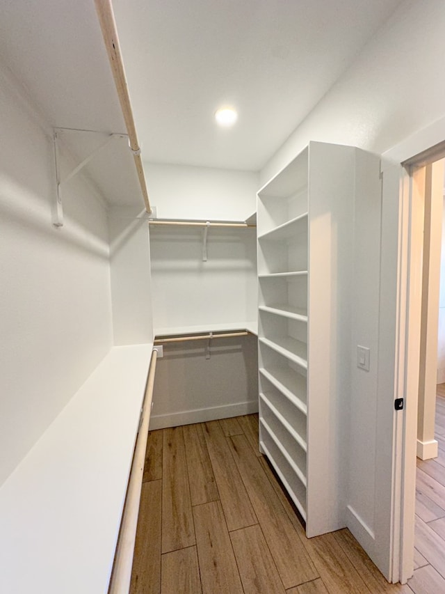 3624 Yorkshire Dr, Odessa, TX 79765 - walk in closet with light wood-type flooring