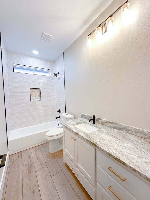 3624 Yorkshire Dr, Odessa, TX 79765 - full bathroom with tiled shower / bath, vanity, and toilet