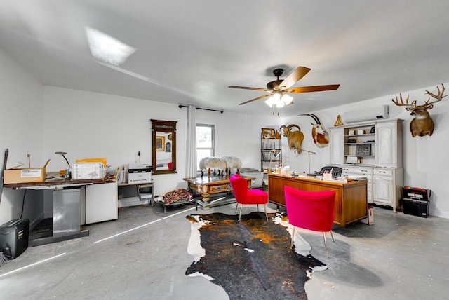 interior space featuring ceiling fan, concrete flooring, and a wall mounted air conditioner