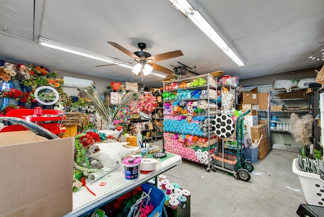 interior space with ceiling fan