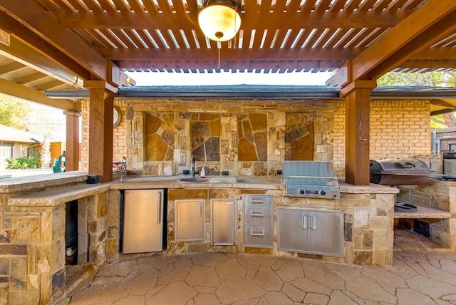 view of patio / terrace with a pergola, area for grilling, and sink