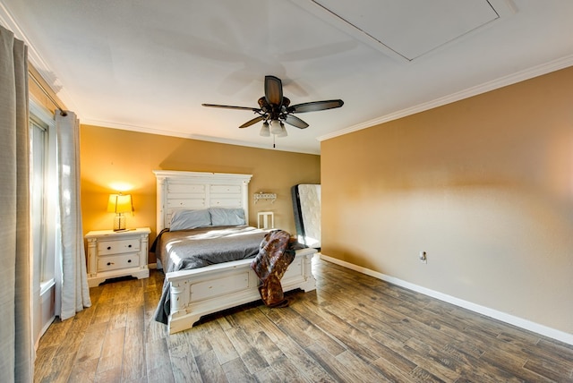 bedroom with hardwood / wood-style floors, ceiling fan, and crown molding