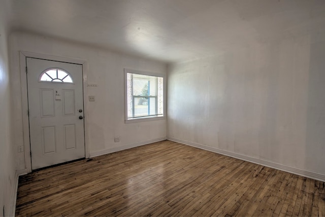 foyer entrance with baseboards and hardwood / wood-style floors