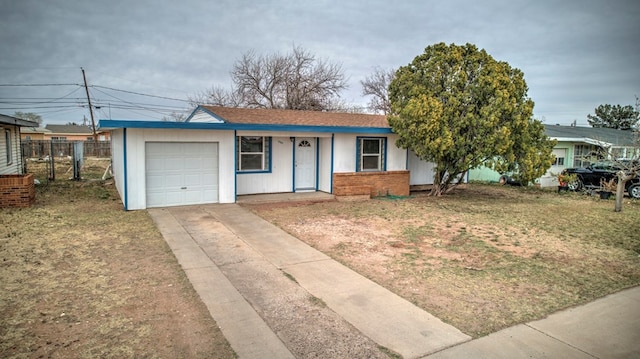 ranch-style home with a front yard, fence, an attached garage, concrete driveway, and brick siding