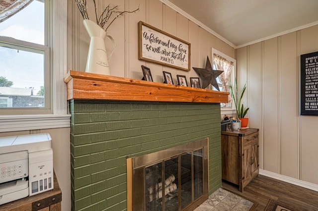 details with a fireplace, hardwood / wood-style floors, and ornamental molding