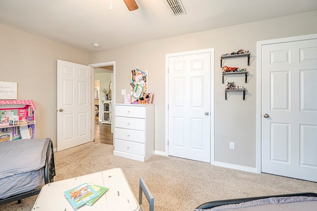 bedroom featuring ceiling fan and light colored carpet