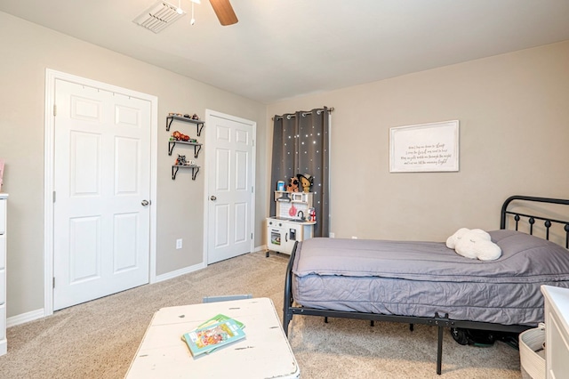 carpeted bedroom with ceiling fan