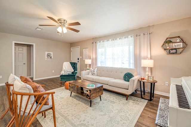 living room with ceiling fan and wood-type flooring