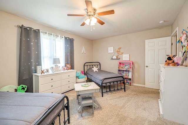 bedroom with ceiling fan and light colored carpet