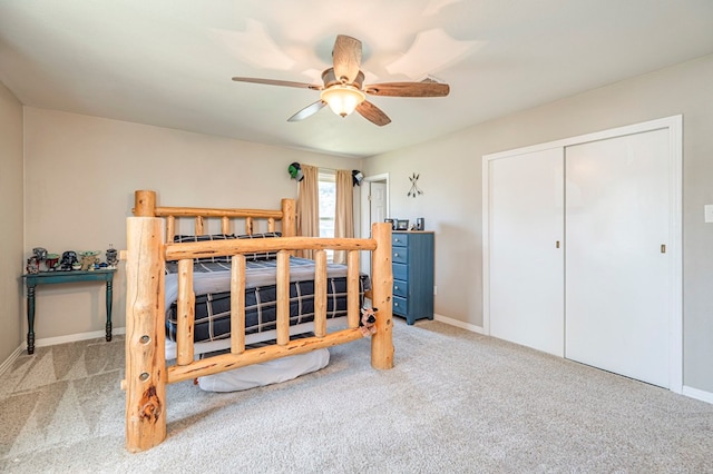 carpeted bedroom featuring a closet and ceiling fan