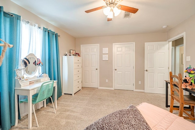 bedroom featuring ceiling fan and light carpet