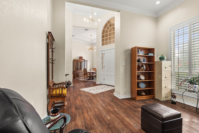 interior space featuring a chandelier, hardwood / wood-style flooring, and ornamental molding