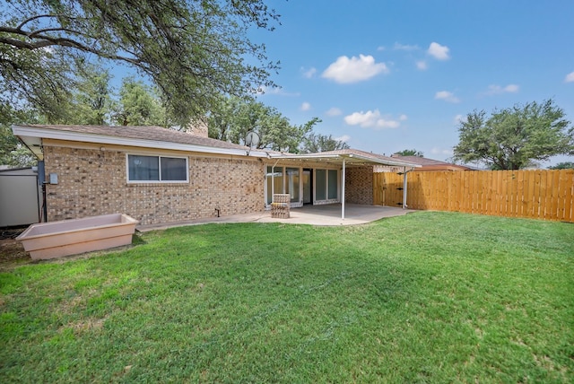 2408 Goddard Ct, Midland, TX 79705 - rear view of property with a patio area and brick siding