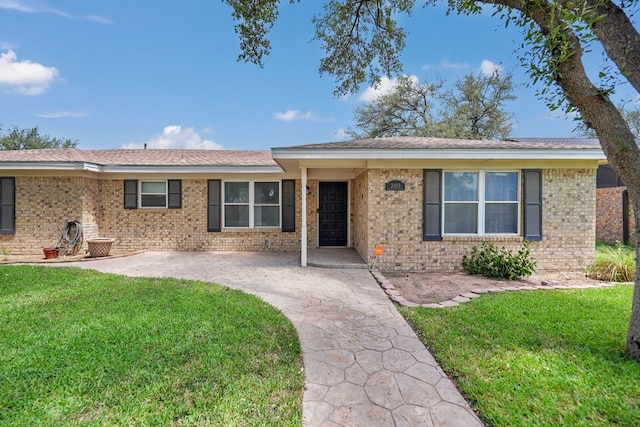 2408 Goddard Ct, Midland, TX 79705 - ranch-style house featuring brick siding and a front lawn