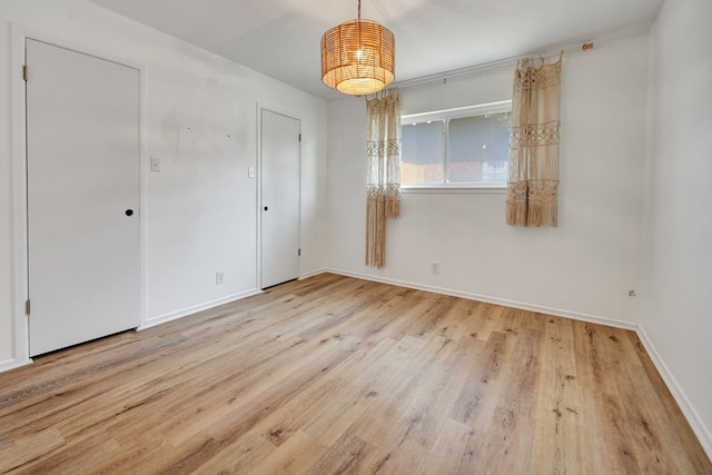 2408 Goddard Ct, Midland, TX 79705 - unfurnished room with wood finished floors and baseboards