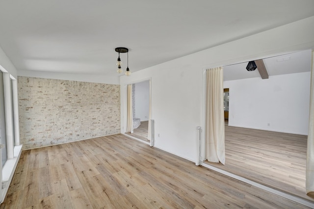 2408 Goddard Ct, Midland, TX 79705 - unfurnished room with wood finished floors and beam ceiling