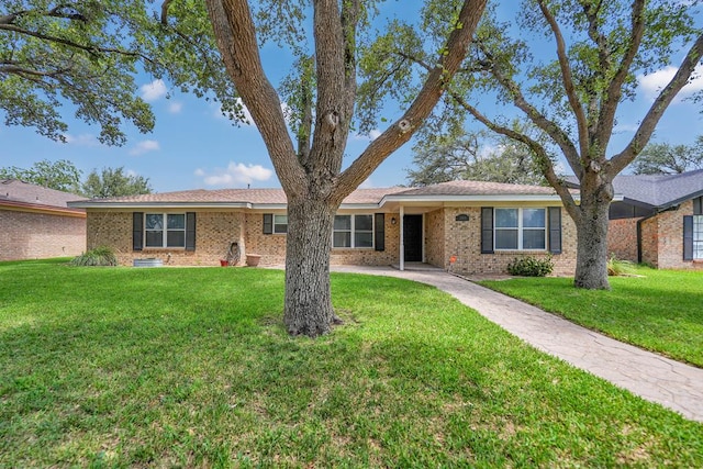 2408 Goddard Ct, Midland, TX 79705 - ranch-style home featuring a front lawn and brick siding