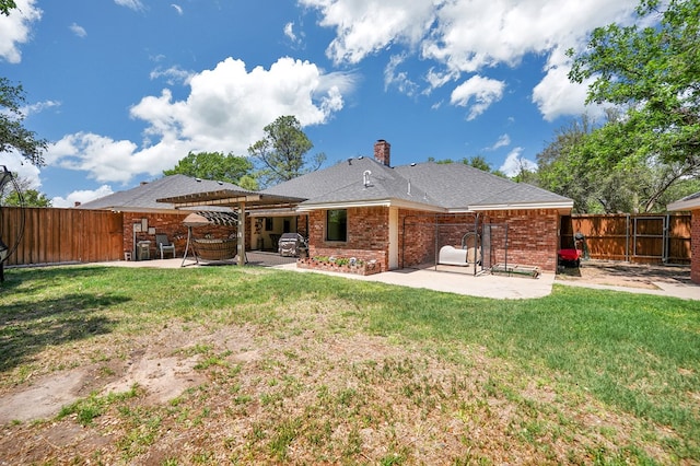 back of property with a fenced backyard, a pergola, a patio, and a lawn