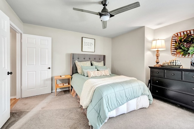 carpeted bedroom with a ceiling fan