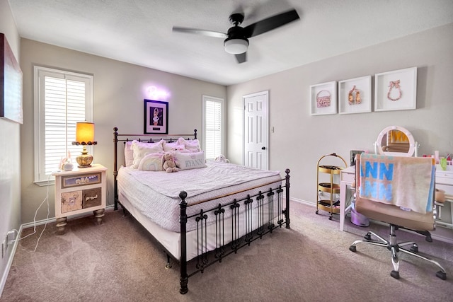 bedroom with carpet, baseboards, and a ceiling fan