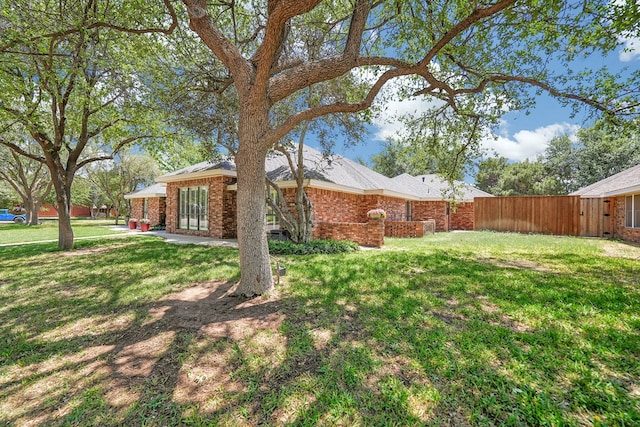 view of yard with fence