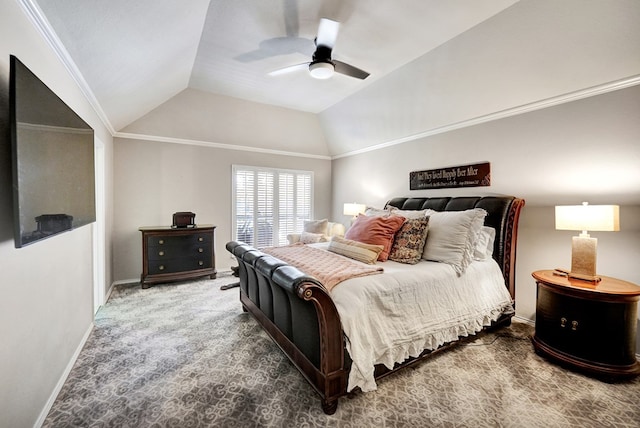 carpeted bedroom featuring baseboards, ornamental molding, ceiling fan, and vaulted ceiling