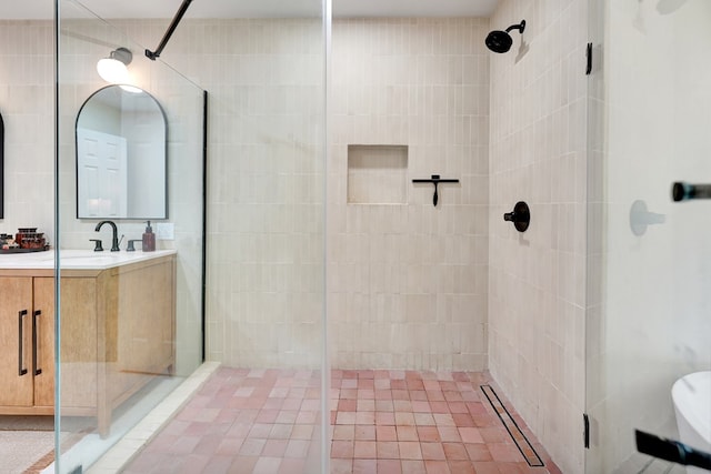 bathroom with vanity and a shower stall