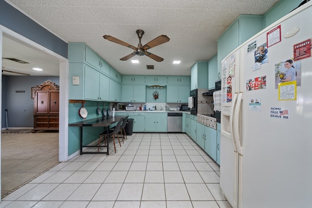 3800 Mcchristian Rd, Big Spring, TX 79720 - kitchen featuring white fridge with ice dispenser, stainless steel dishwasher, ceiling fan, light tile patterned floors, and oven
