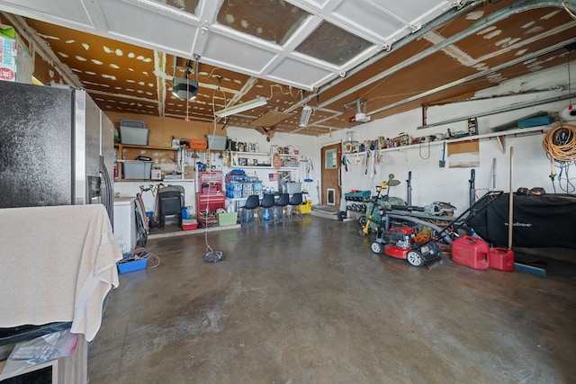 3800 Mcchristian Rd, Big Spring, TX 79720 - garage featuring a garage door opener and a workshop area