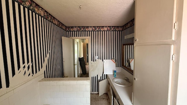3603 Sinclair Ave, Midland, TX 79707 - bathroom with vanity and a textured ceiling