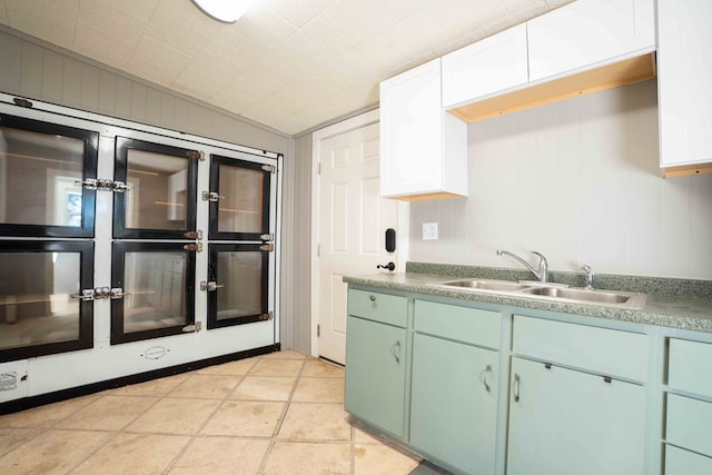 2950 Ranch Road 33, Big Spring, TX 79720 - kitchen with green cabinetry, lofted ceiling, light countertops, and white cabinets