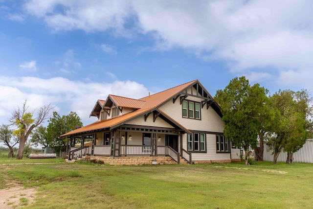 2950 Ranch Road 33, Big Spring, TX 79720 - view of front facade featuring covered porch, a front yard, and a metal roof