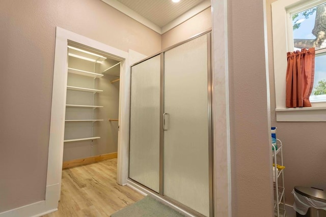 2950 Ranch Road 33, Big Spring, TX 79720 - bathroom with a shower stall, wood finished floors, and a walk in closet