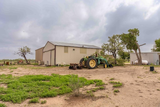 2950 Ranch Road 33, Big Spring, TX 79720 - rear view of property with a pole building, an outbuilding, and a metal roof