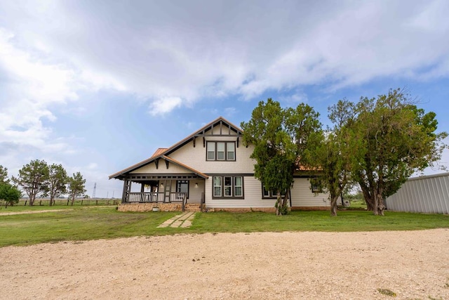 2950 Ranch Road 33, Big Spring, TX 79720 - back of property featuring covered porch and a lawn